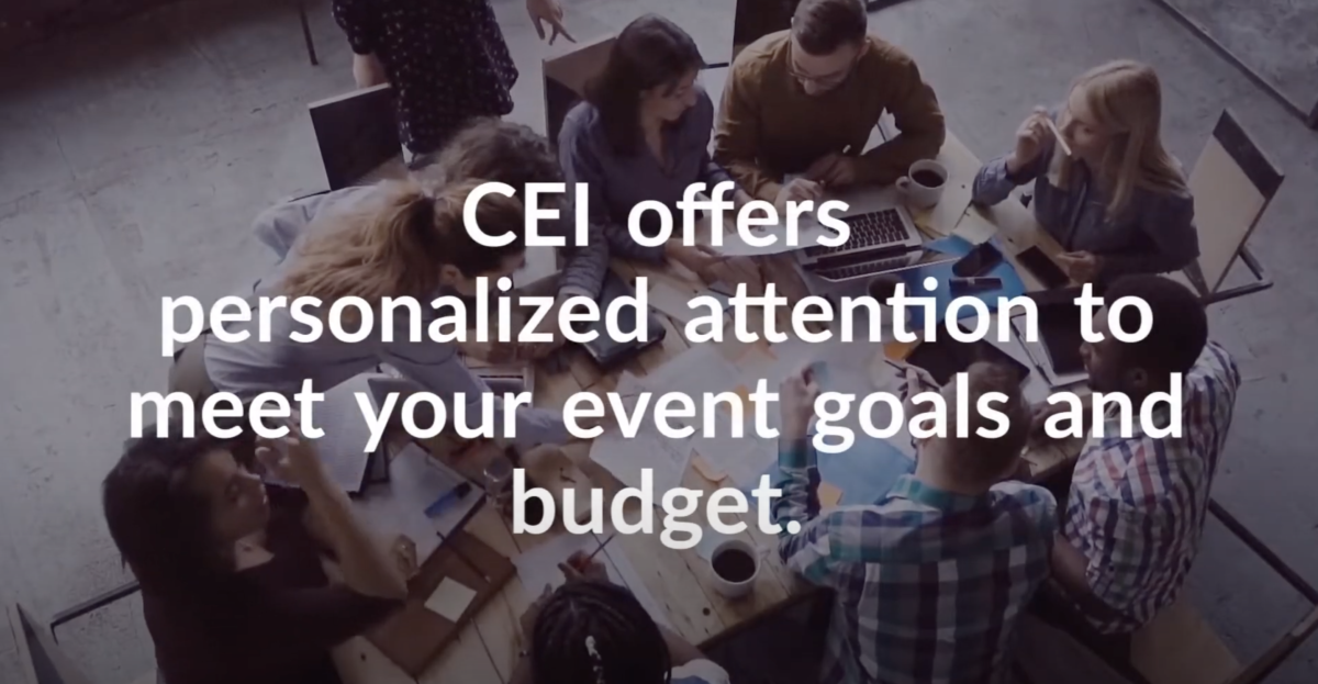 Faded overhead view of coworkers sitting and standing around a table with papers, computers, and cups of coffee, collaborating and talking together, text reads "CEI offers personalized attention to meet your event goals and budget."